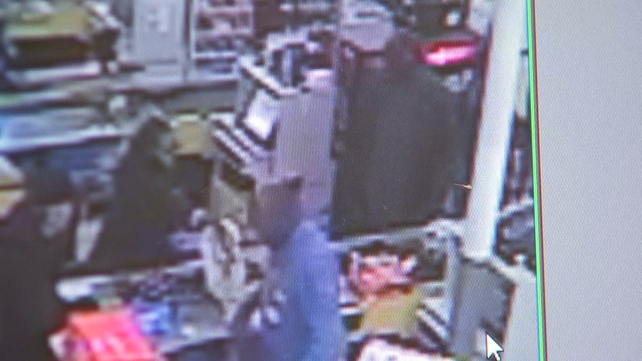 Video shows man attack elderly woman in grocery store checkout line