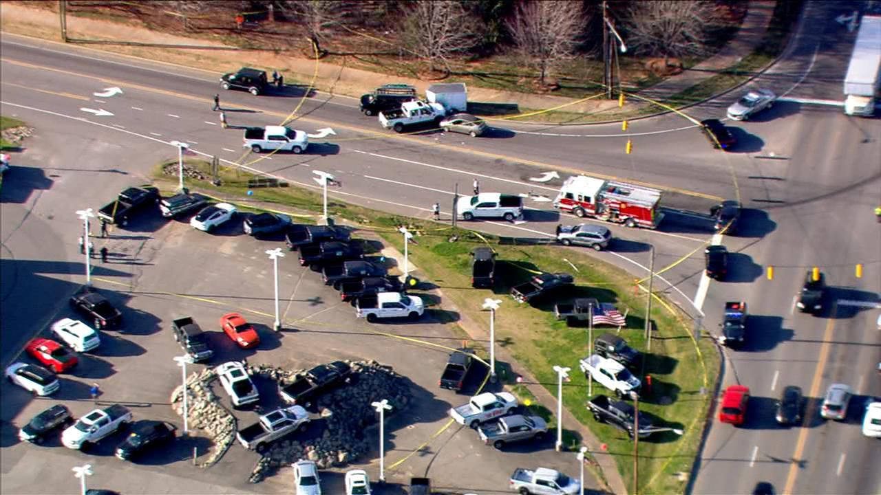 Police on scene of officerinvolved shooting outside of car dealership