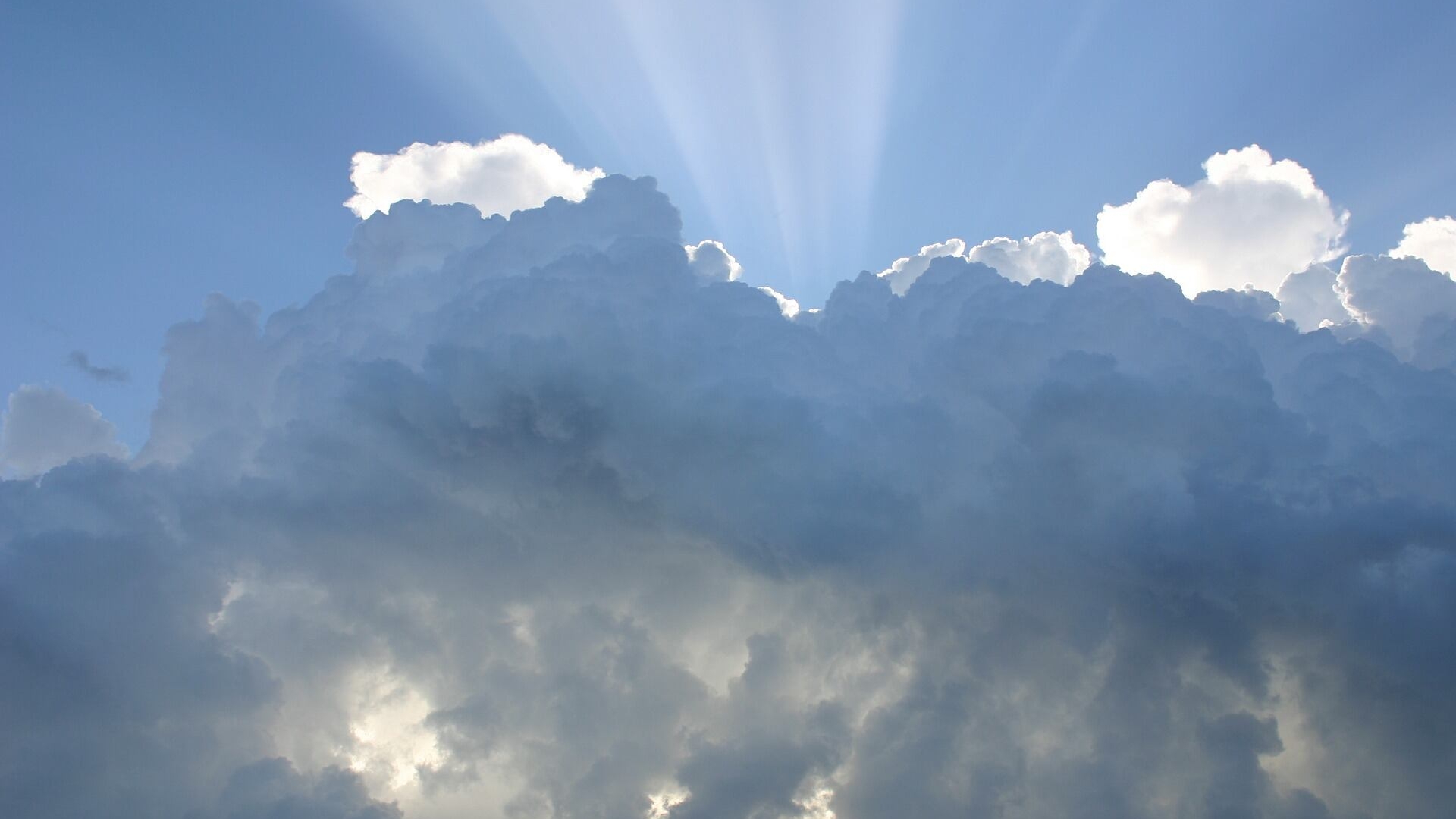 Clouds break for sun as humidity decreases