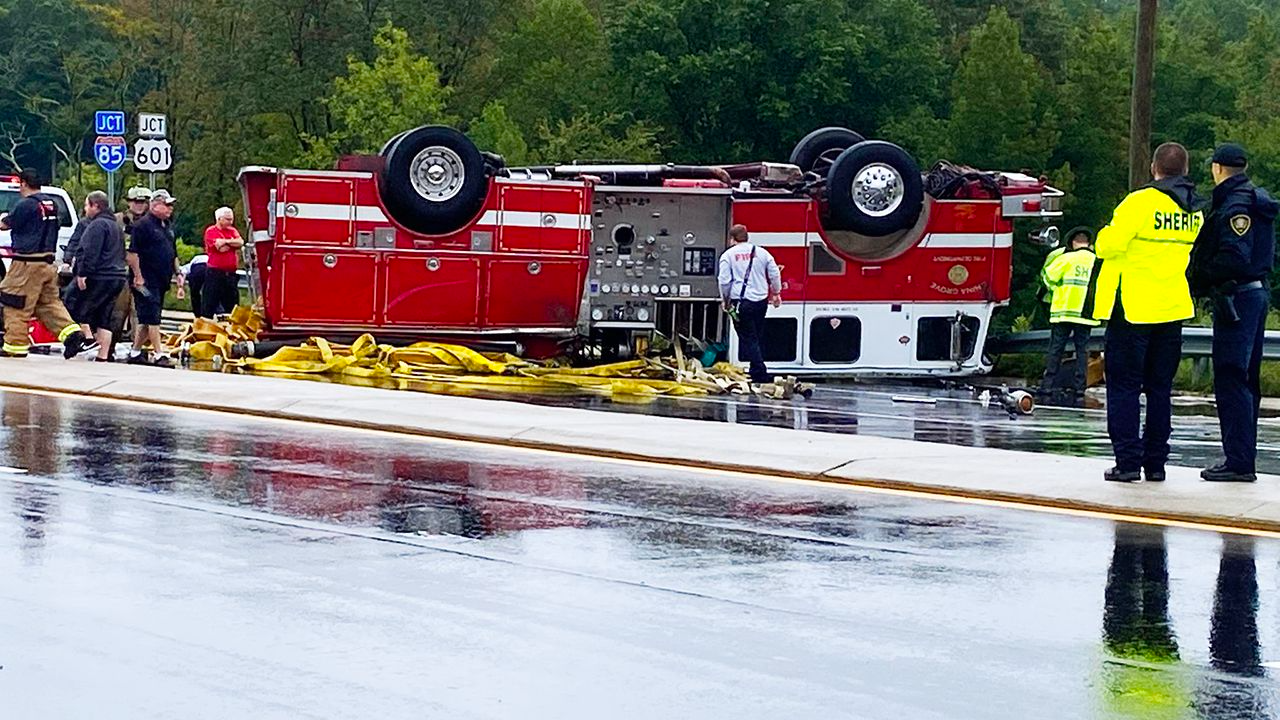 China Grove fire truck responding to crash ends up on roof near I85