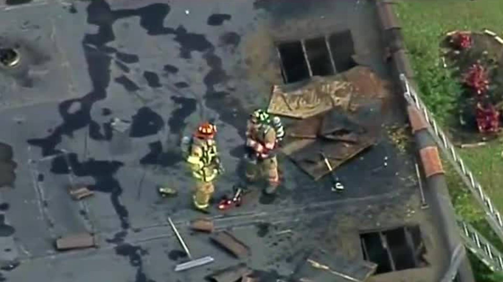 Two people rescued from side window at apartment building fire in