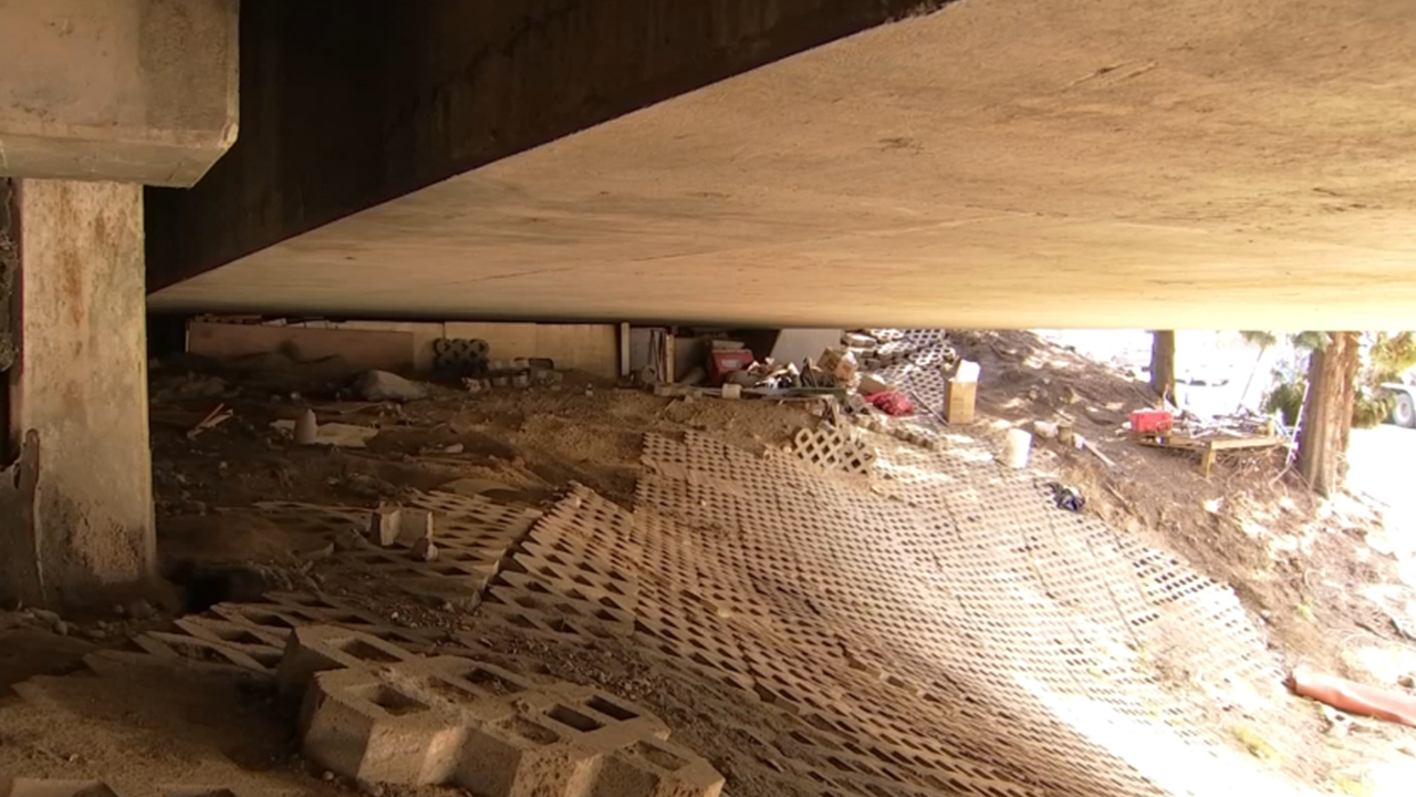 Homeless people uproot brick, dig tunnels beneath highway overpass