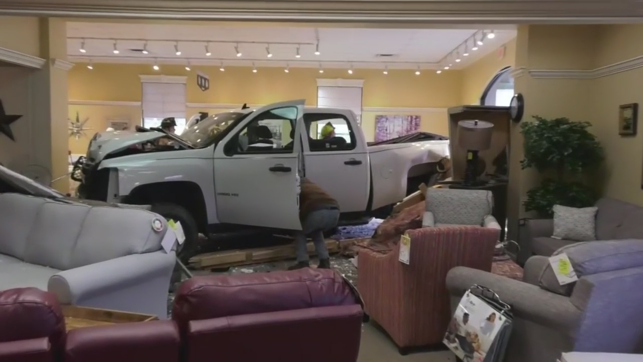 Crash into furniture store sends truck driver to hospital WPXI