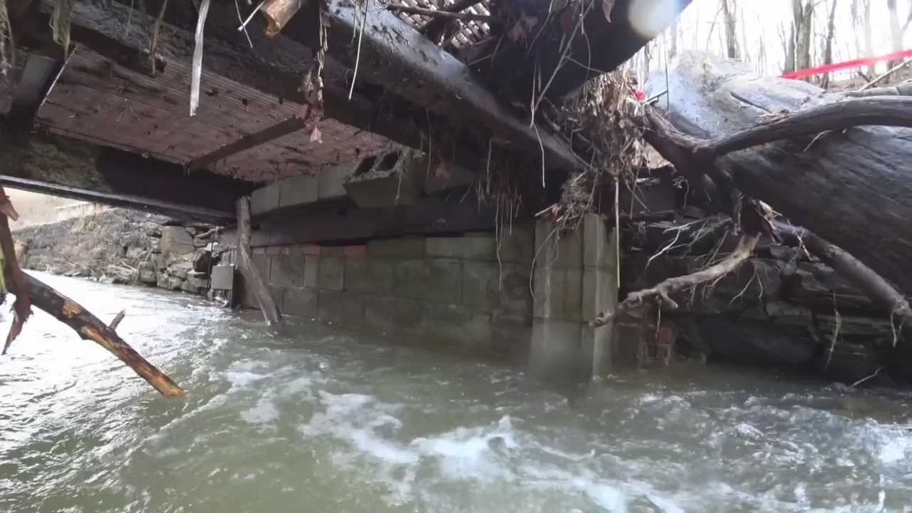 Residents ask for help after heavy rain washes out bridge, road
