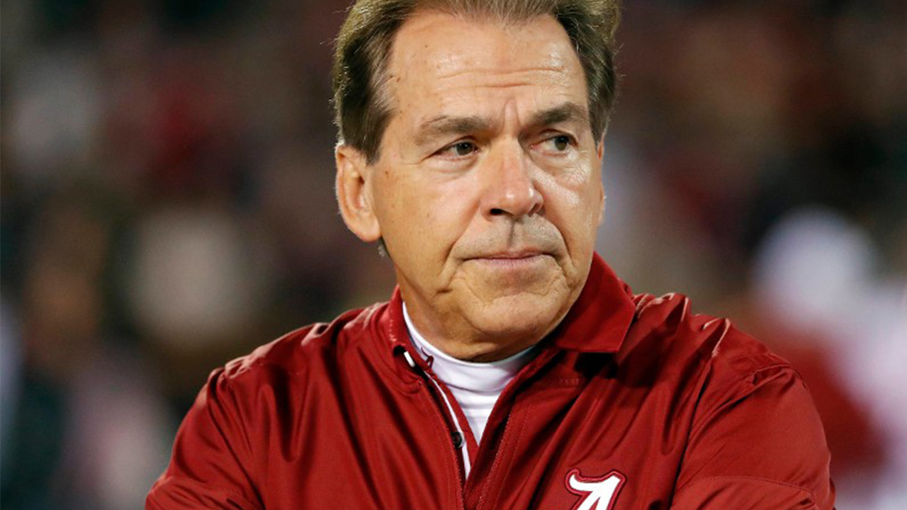 University of Alabama head football coach Nick Saban leads players