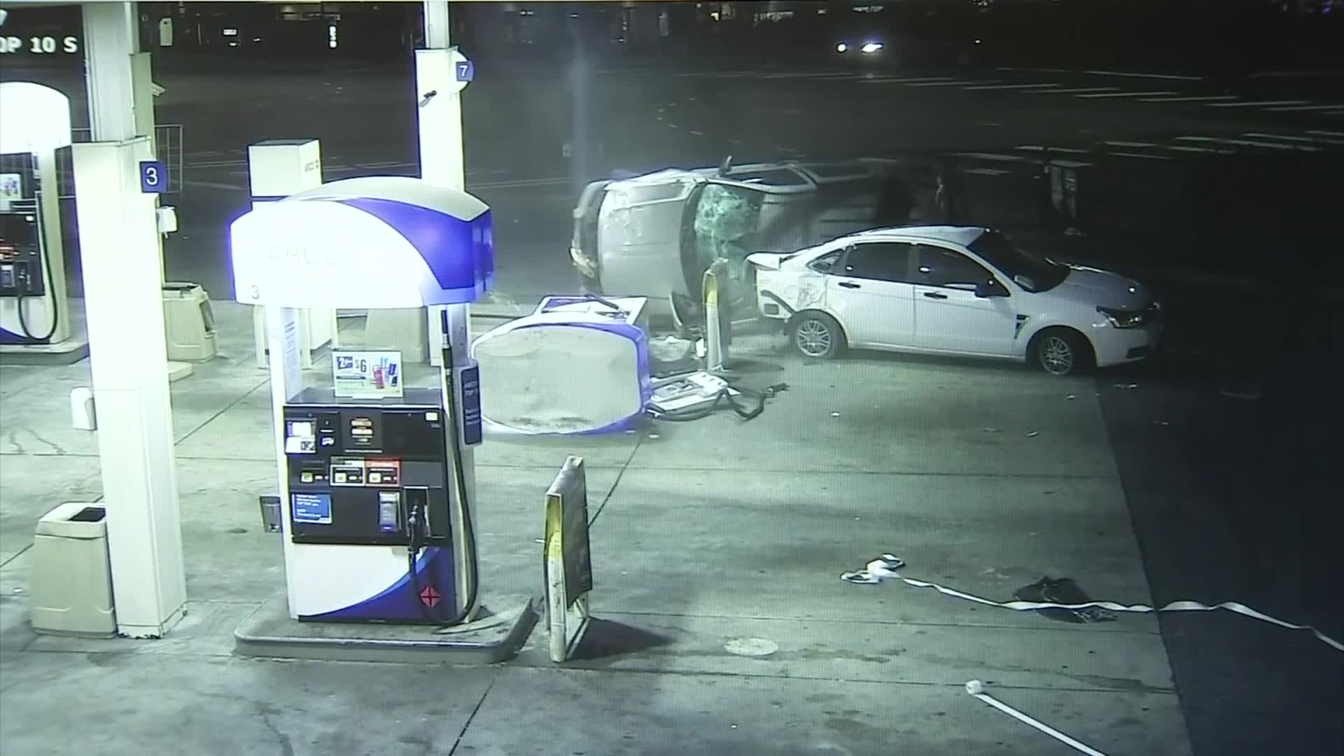 Video shows speeding SUV crash into car, gas pump in